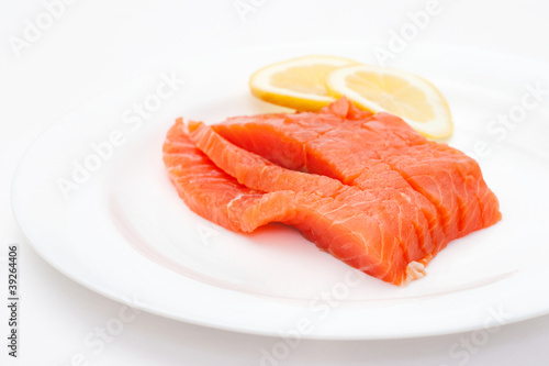 fresh salmon steak over white background