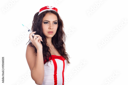 Portrait of a beautiful young nurse with syringe