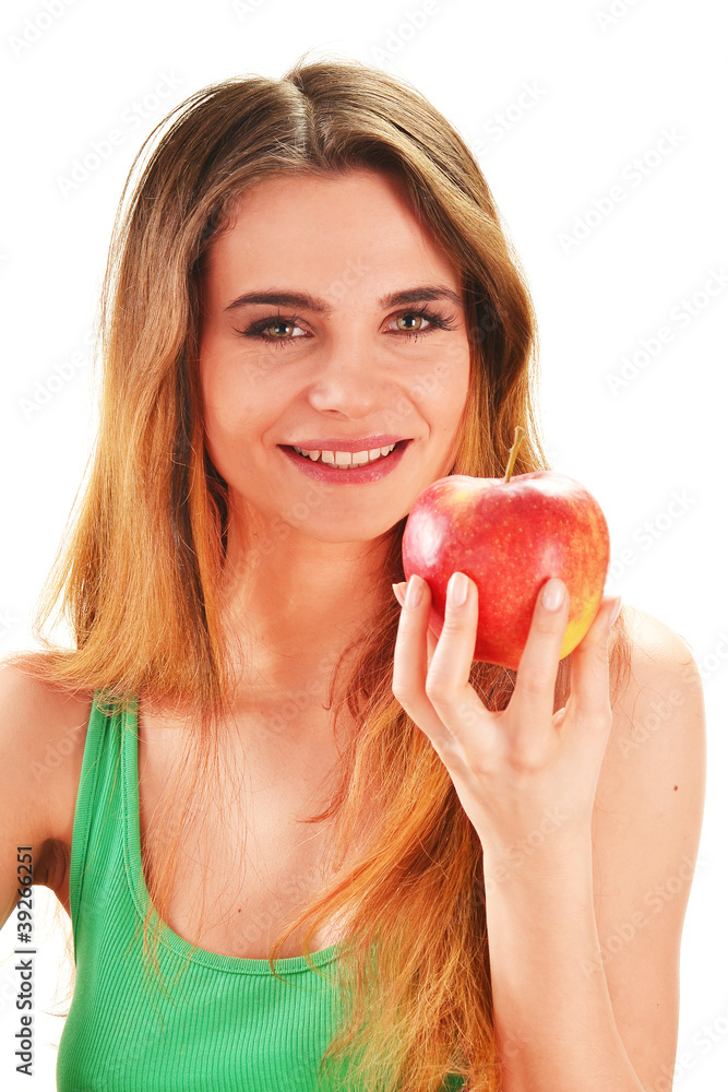 Young beautiful woman holding a red ripe apple in her hand Young beautiful woman holding a red ripe apple in her hand
