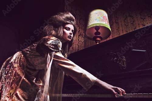 Photography Vogue style vintage portrait in luxury interior.