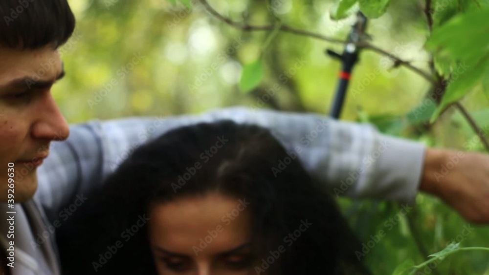 Close up of young hikers threading their way through a thicket Close up of young hikers threading their way through a thicket