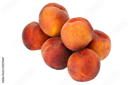 Fresh yellow peaches isolated on white
