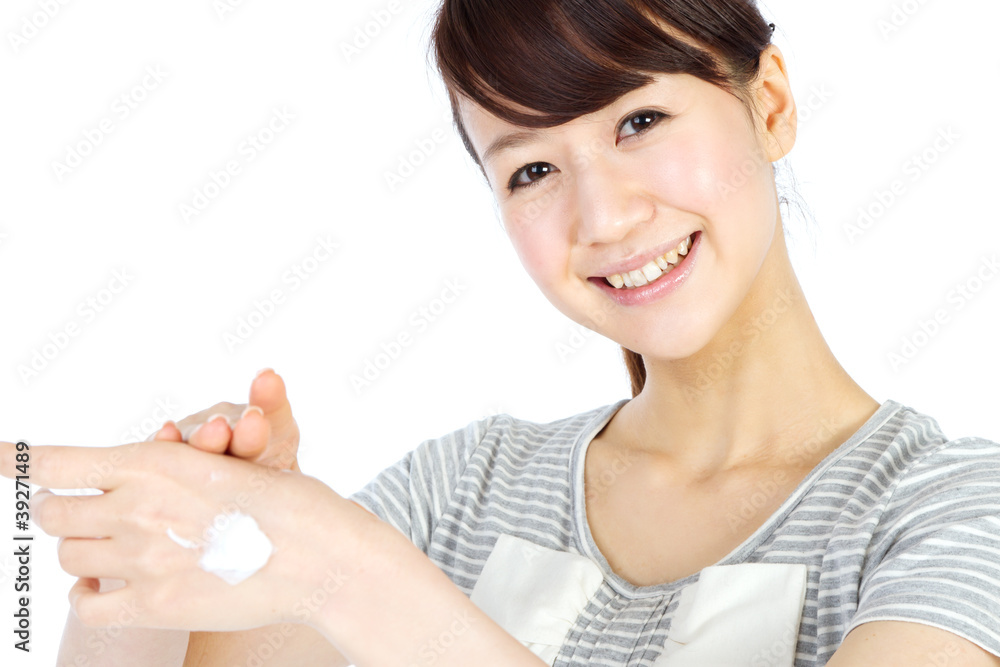 Beautiful woman with cream in her hand