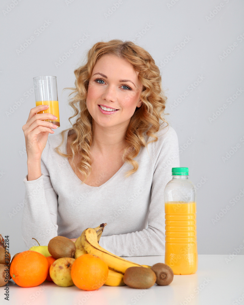 Attractive blond woman drinking orange juice Attractive blond woman drinking orange juice