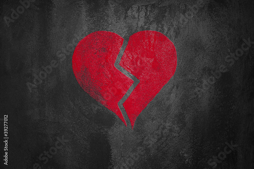 red broken  heart on abstract dark cement background