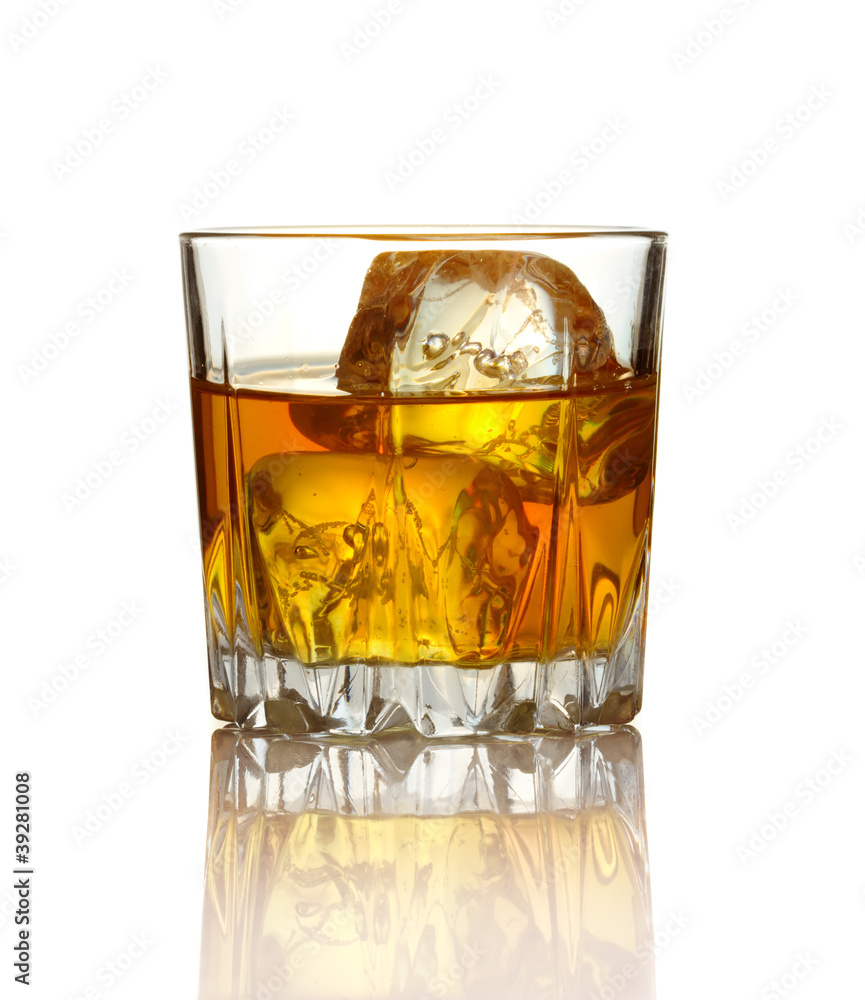 Glass of whiskey and ice isolated on white