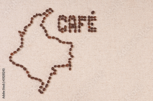 Coffee beans on canvas in the shape of Colombia and Cafe photo