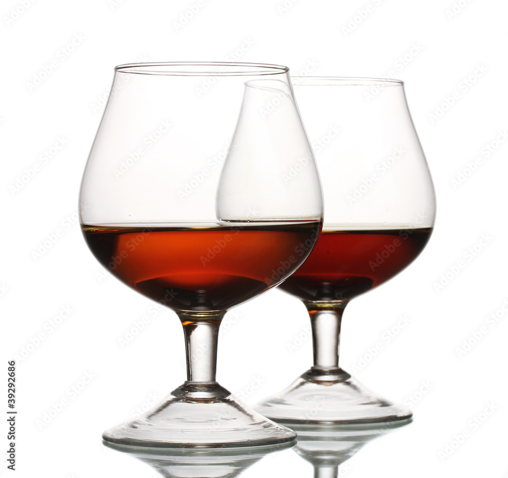 Two glasses of cognac isolated on white Two glasses of cognac isolated on white