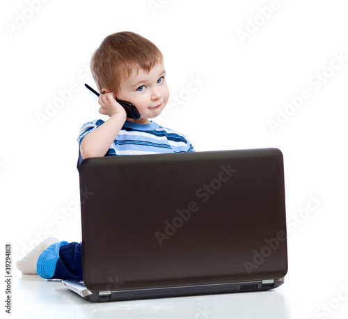 Child with laptop and mobil...