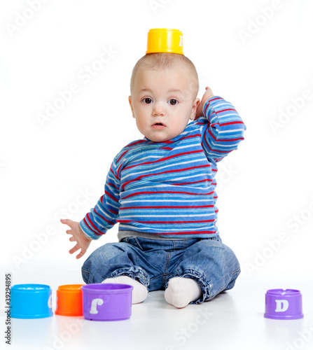 Funny little child is playi...
