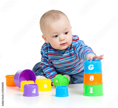 baby is playing with educational toys, isolated over white