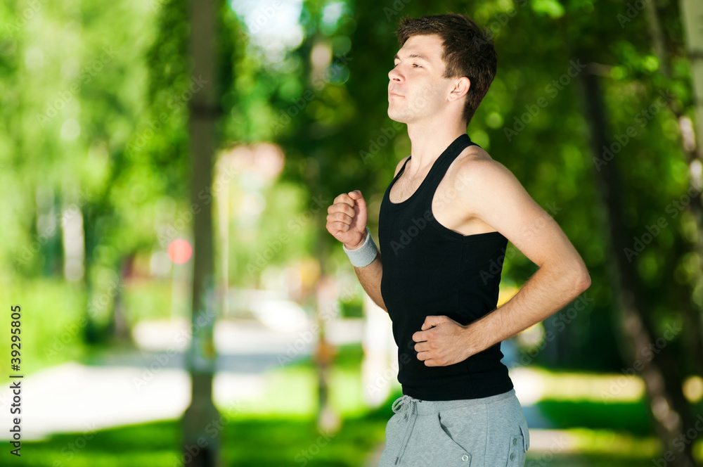 Young man jogging in park Young man jogging in park