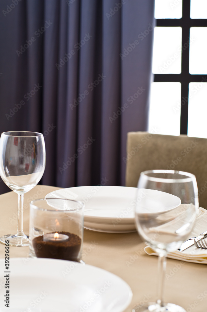Inside interior table setting with beautiful tableware Inside interior table setting with beautiful tableware