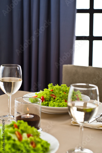 Inside interior table setting with beautiful salad
