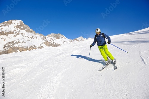 skiing on fresh snow at winter season at beautiful sunny day © .shock