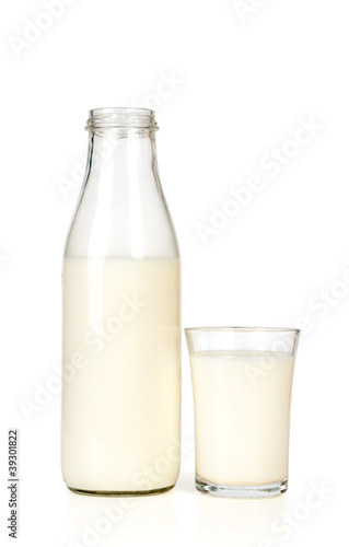 Milk bottle and glass. Isolated on white background