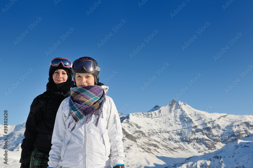 winter portrait of friends at skiing
