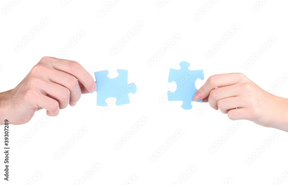 Hands and puzzle, isolated on white Hands and puzzle, isolated on white