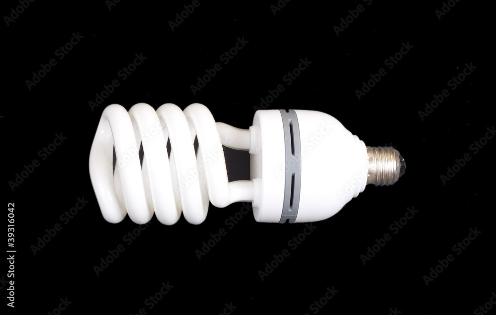 Energy-saving lamp isolated on black bac Energy-saving lamp isolated on black bac