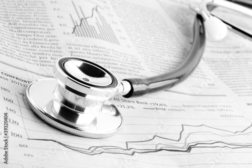 stethoscope on financial chart photo