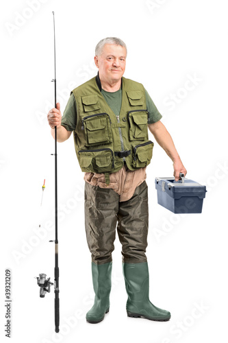 Mature fisherman holding a fishing equipment