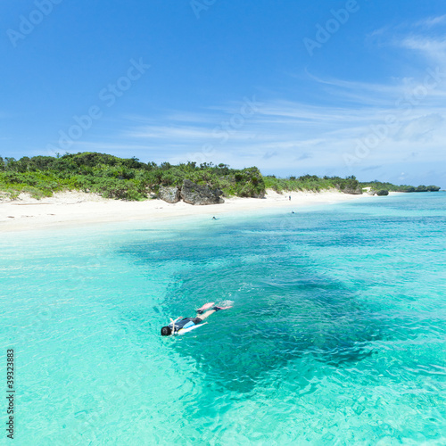 Snorkeling in tropical water of a coral lagoon, Okinawa