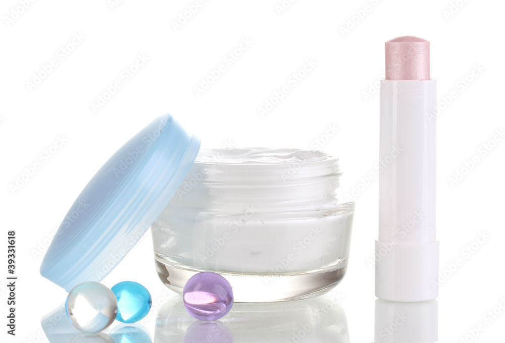Hygienic lipstick and moisturizing cream isolated on white Hygienic lipstick and moisturizing cream isolated on white