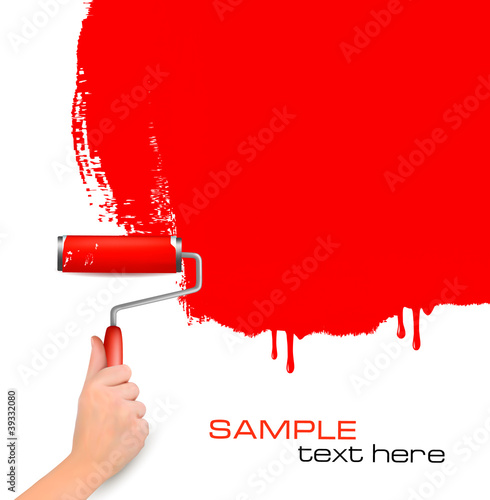 Hand with red roller painting the white wall