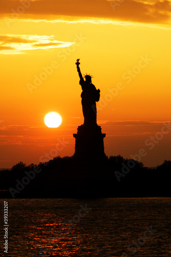 Statue of Liberty silhouette at sunset