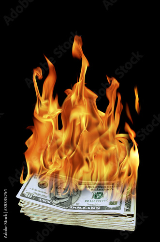 an image of a pile of dollar bills on fire
