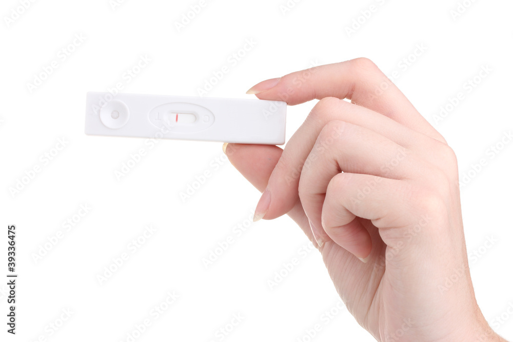 pregnancy test in hand isolated on white pregnancy test in hand isolated on white