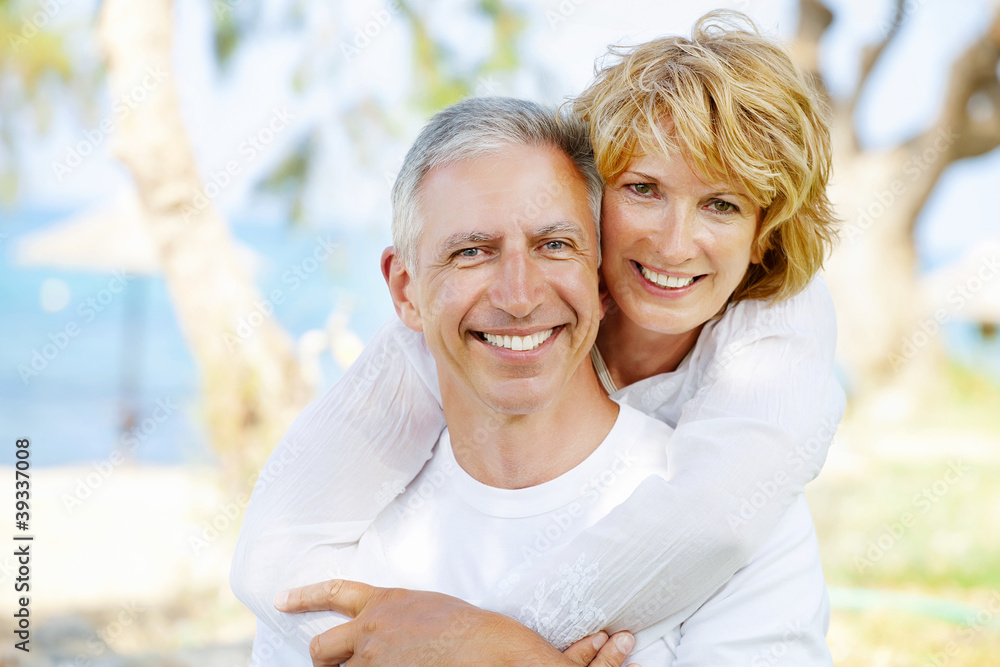 Mature couple smiling and embracing. Mature couple smiling and embracing.