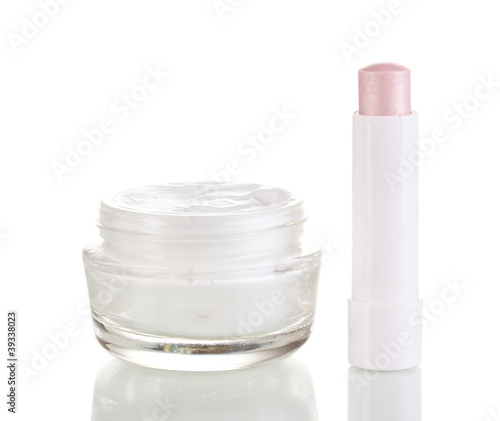 Hygienic lipstick and moisturizing cream isolated on white