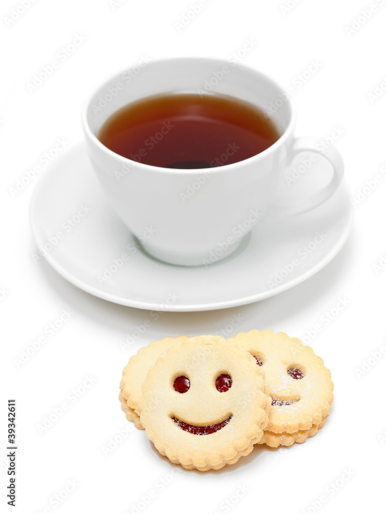 cup of tea with smiling cookies cup of tea with smiling cookies