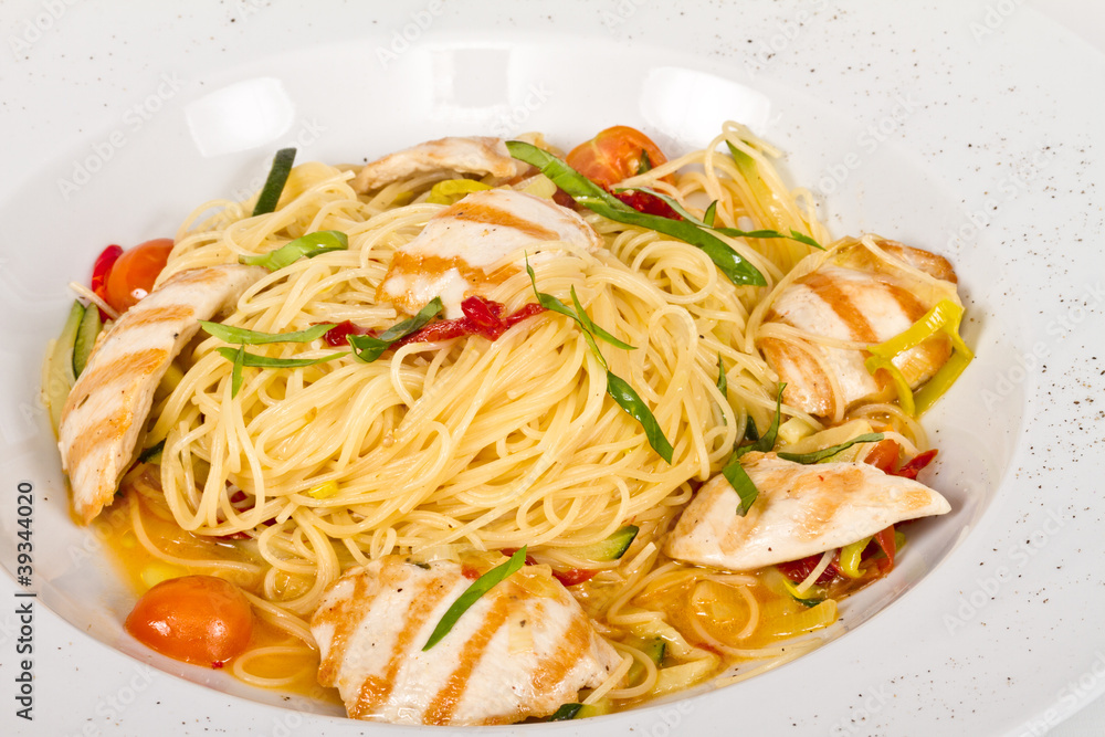 close-up of plate of pasta and chicken close-up of plate of pasta and chicken