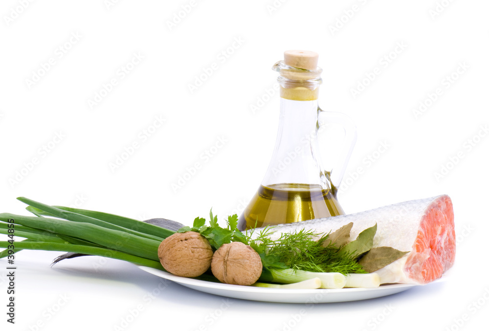 Piece of a salmon with olive oil and green onion Piece of a salmon with olive oil and green onion