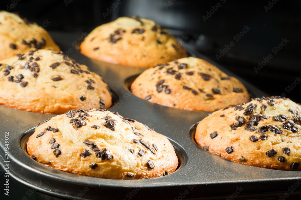 Muffin with chocolate chip in baking tray Muffin with chocolate chip in baking tray
