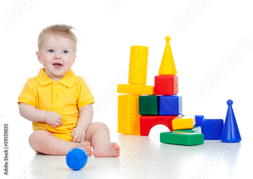 little child playing with b...