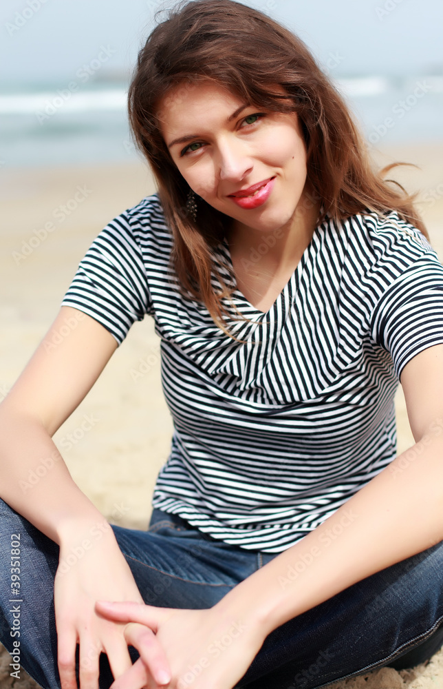 Beautiful girl on the winter beach Beautiful girl on the winter beach