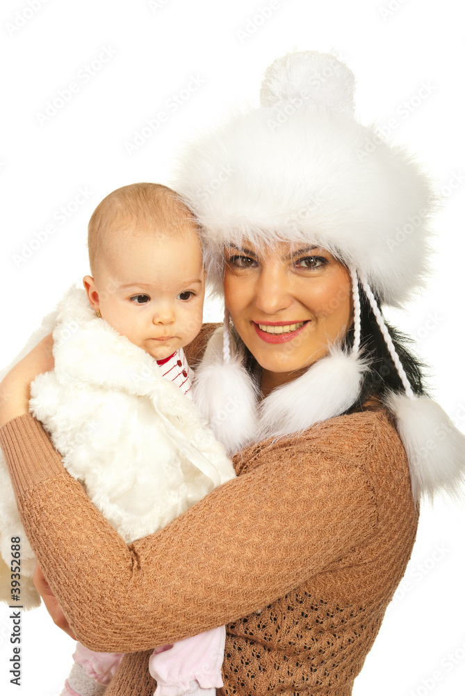 Cheerful mother and baby in fur clothing