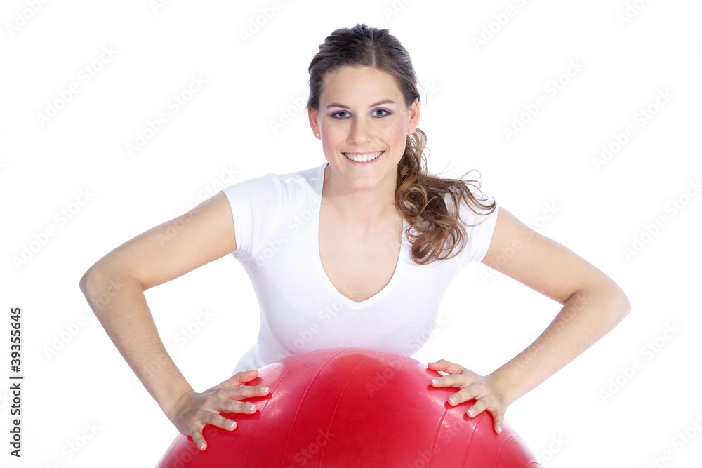 Sportlerin lacht auf Trainingsball Porträt Sportlerin lacht auf Trainingsball Porträt