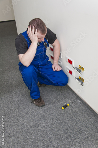 man watching the electrical socket photo