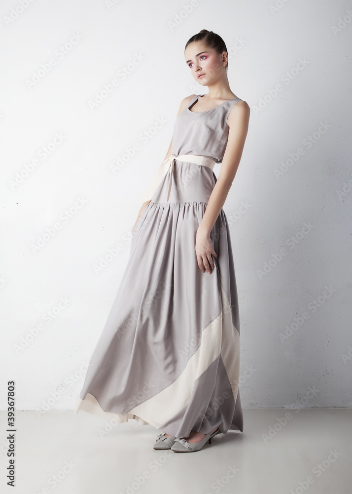 Fototapeta premium Romantic young woman beauty wearing white fashion dress