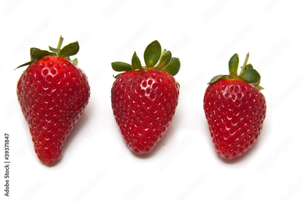 Strawberries isolated on a white studio background. Strawberries isolated on a white studio background.