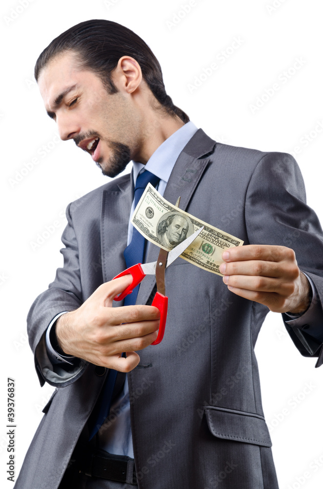 Man cutting money on white