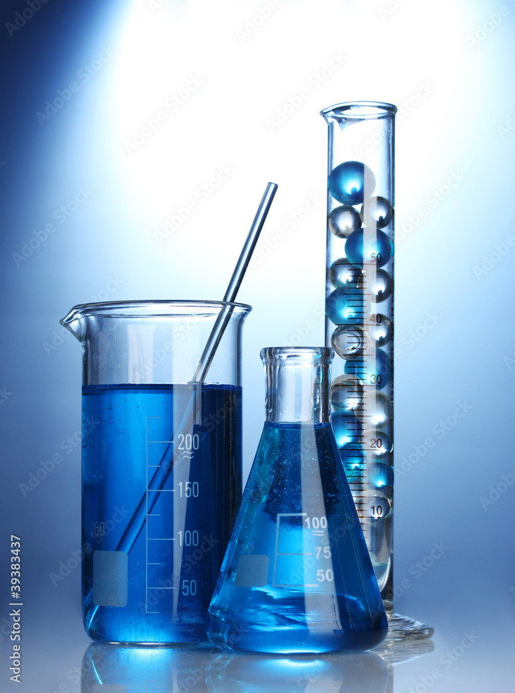 Test-tubes with blue liquid on blue background Test-tubes with blue liquid on blue background