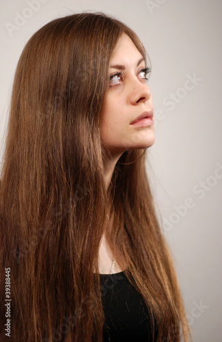 Young woman with very long beautiful hair, vertical portrait