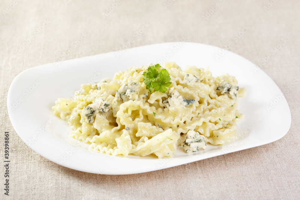 European cuisine. Pasta in cream sauce with blue cheese
