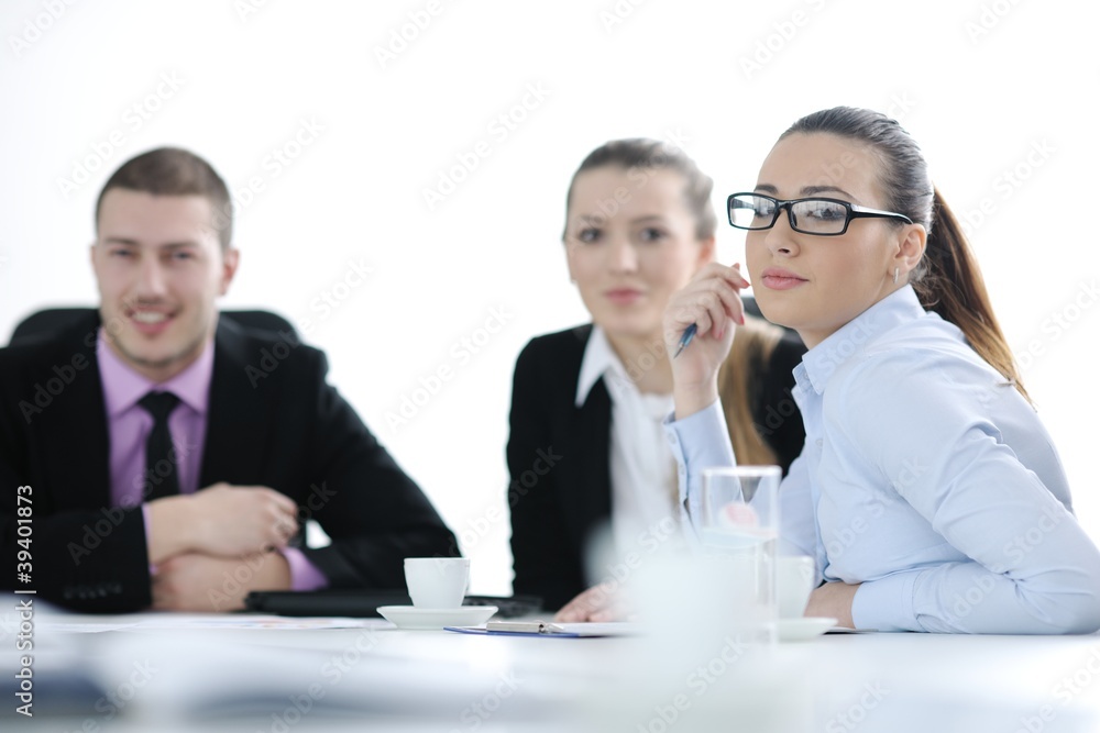 business woman standing with her staff in background business woman standing with her staff in background