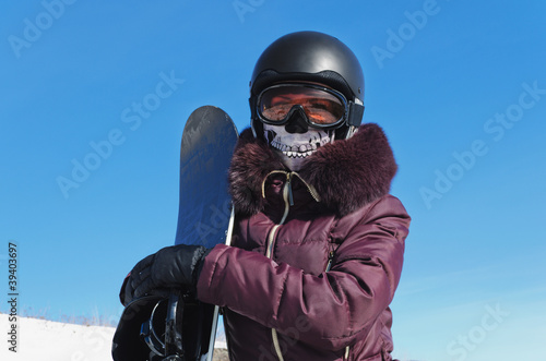 The young woman with a snowboard